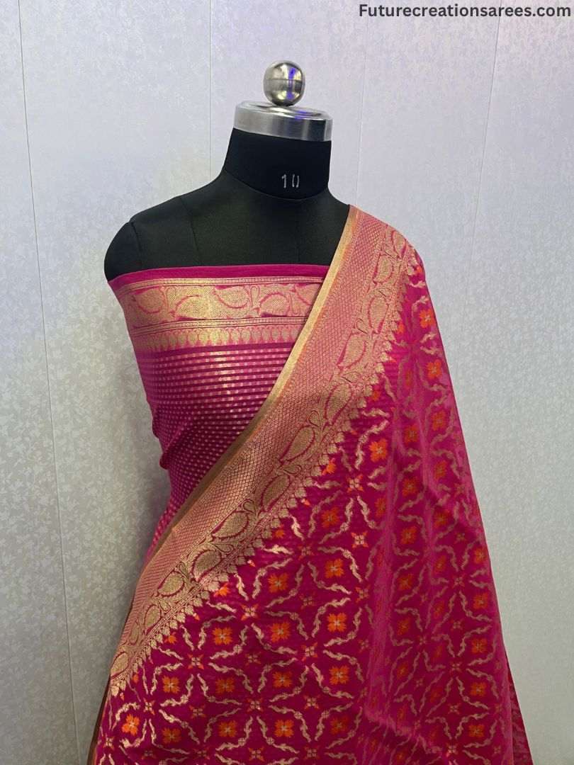 Mannequin wearing magenta cotton zari alfi saree with golden-orange floral motifs, striped chest panel, and leaf-style border — Future Creation Sarees